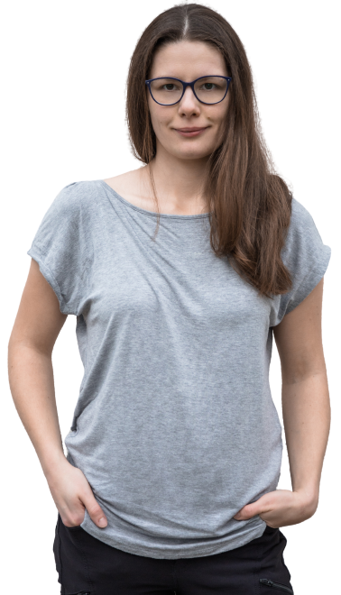 women with grey shirt, glasses, brown hair, smiling